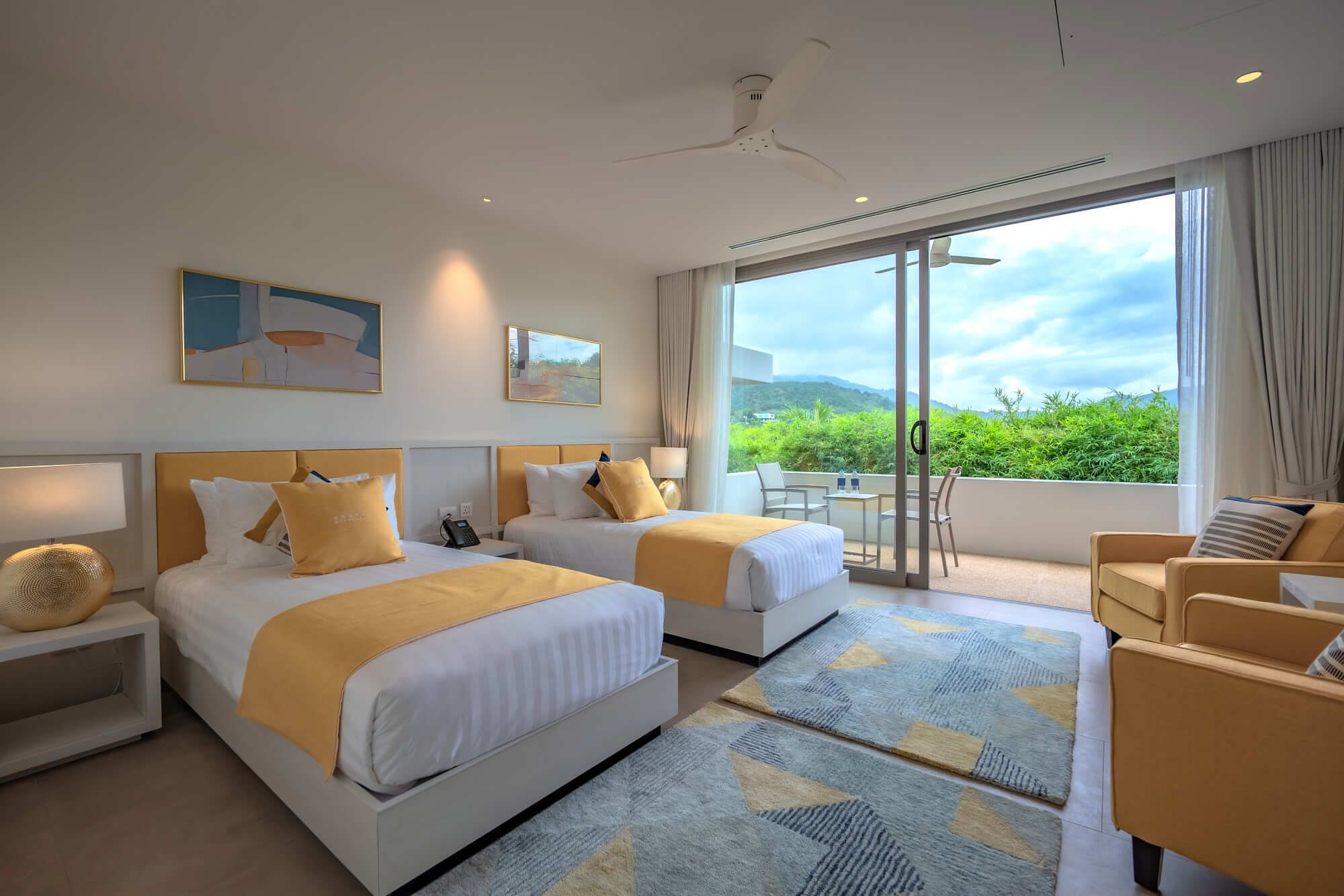 Bedroom Six with twin beds and balcony.