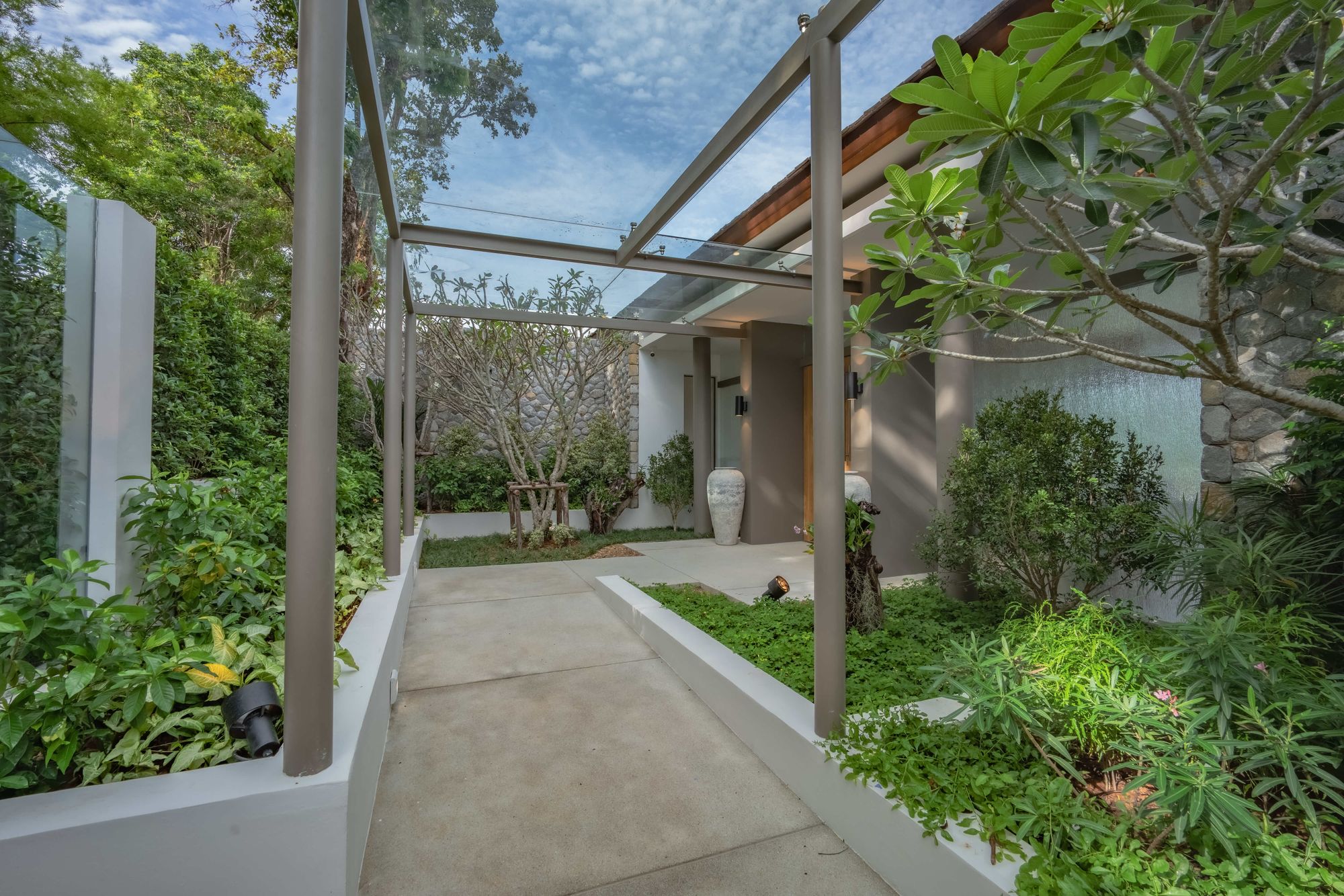 Foliage surrounds the main entrance.